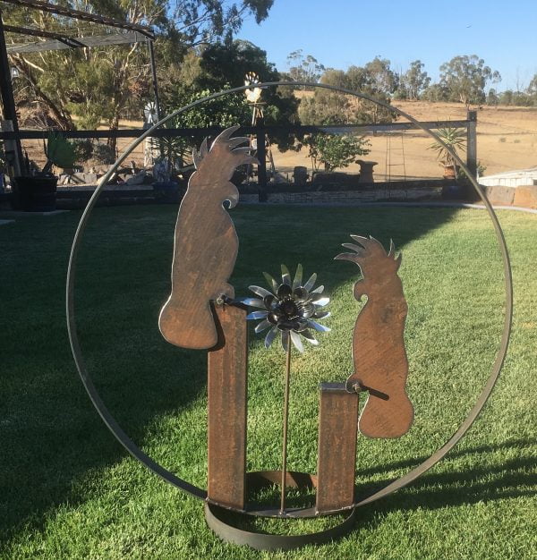 2 Cocky's with cutlery flower